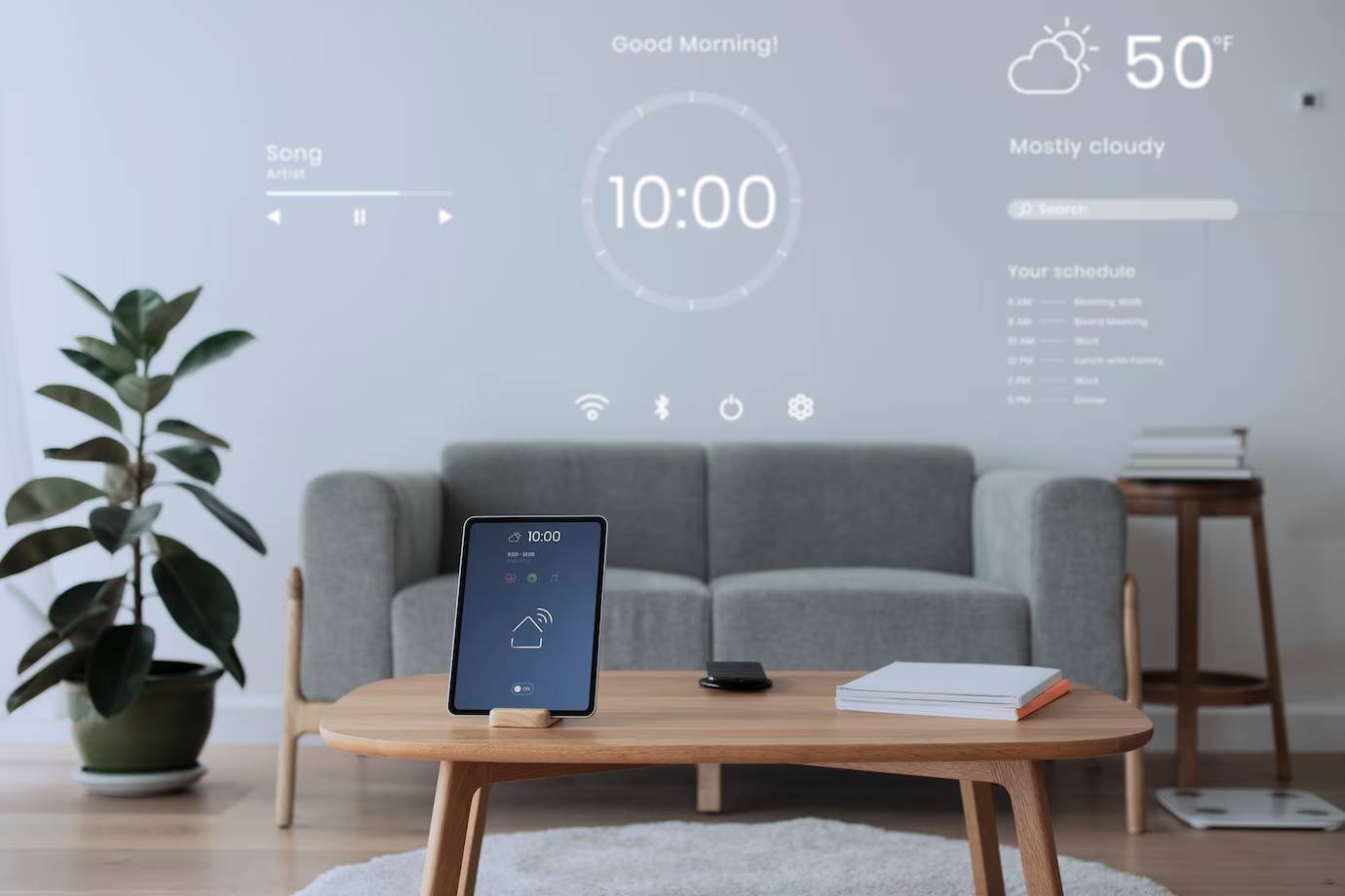 A modern living room with a tablet displaying a digital clock and schedule, while smart projections show weather and music info on the wall.